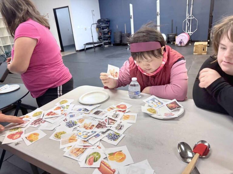 individuals learning about nutrition with cards