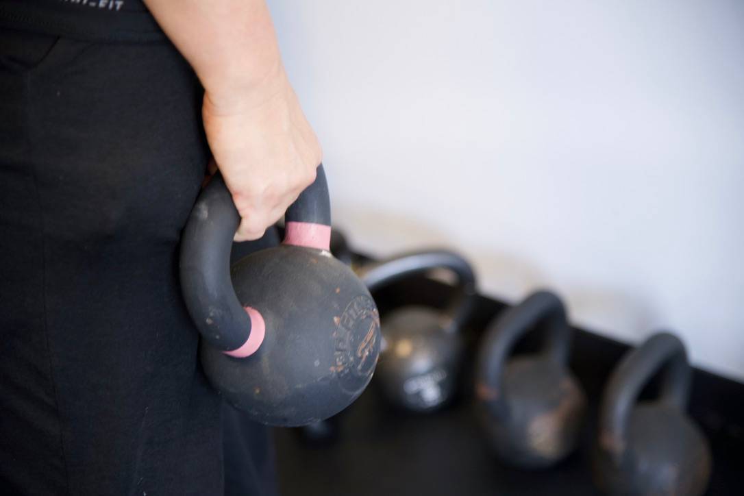 Close-up of a kettlebell in an athlete's hand